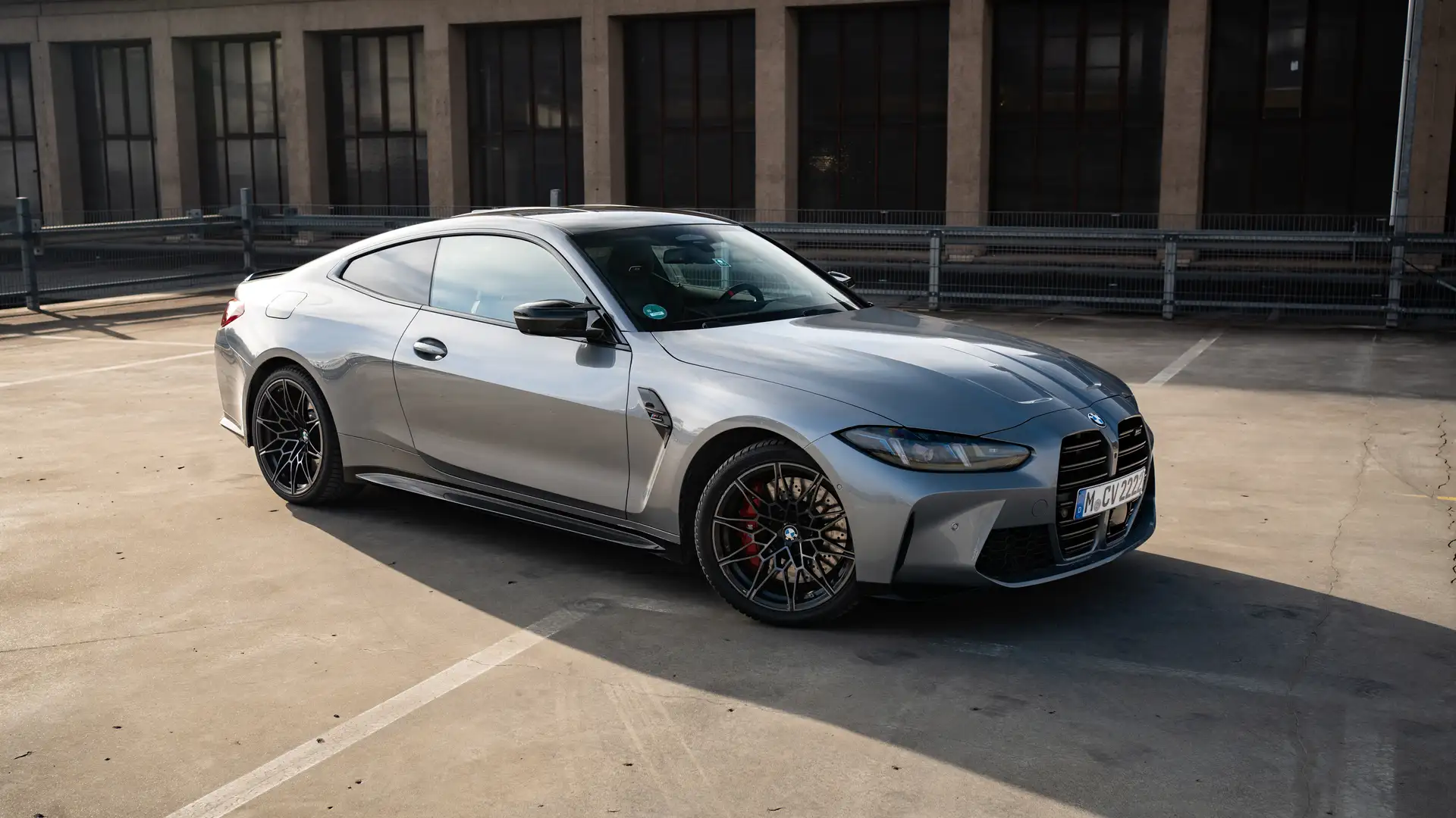 Our BMW M4 in Skyscraper Grey in the side front view.